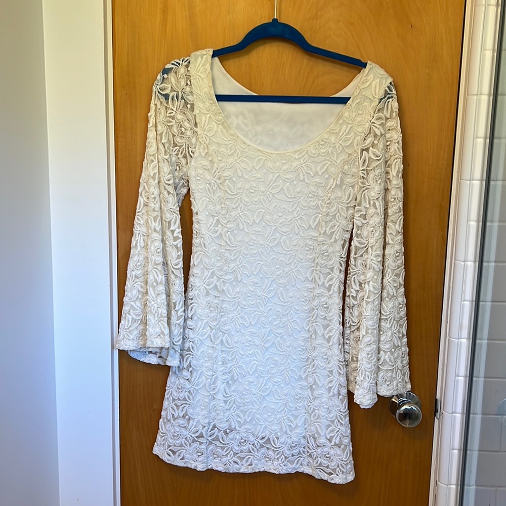 White dress with lace with bell bottom sleeves